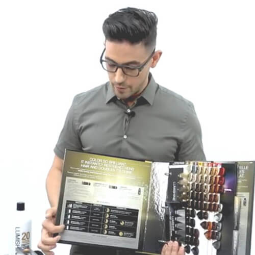 Hiar stylist showing different hair color swatches