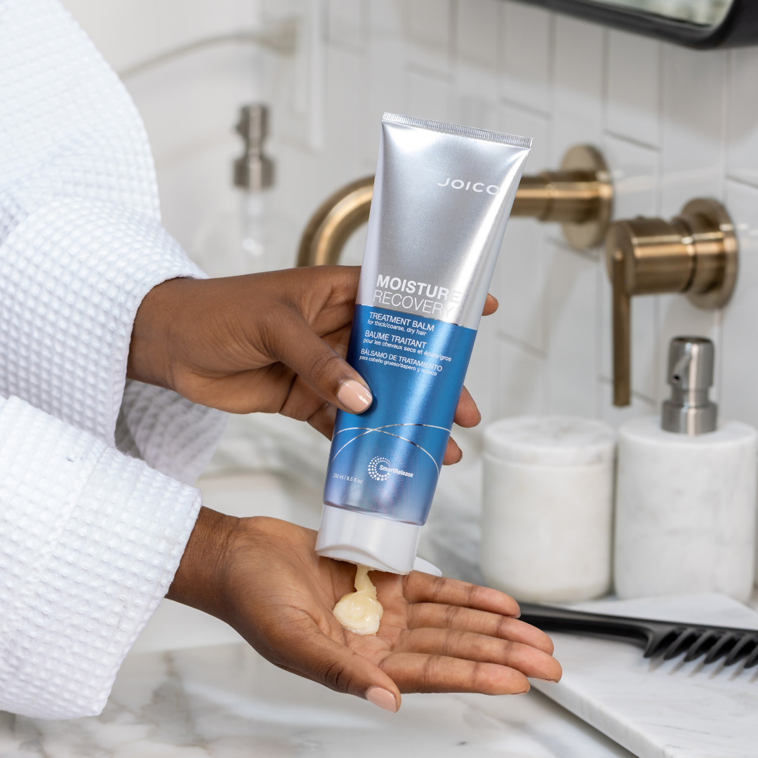 moisture recovery balm pouring into hand