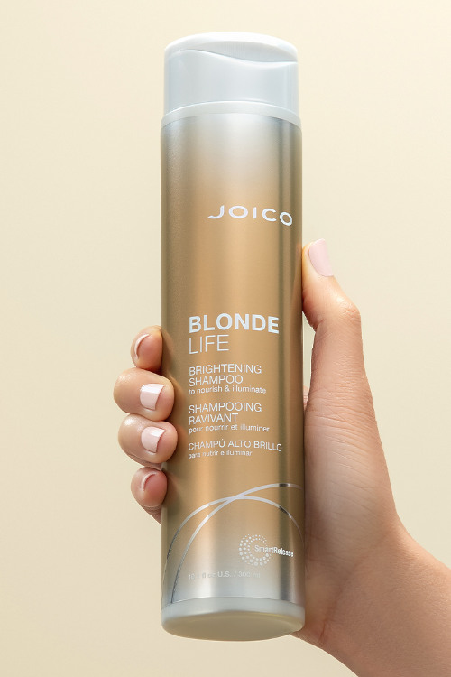 blonde life shampoo hair product in hand