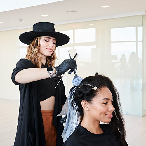 Hairstylist larisa love coloring clients hair