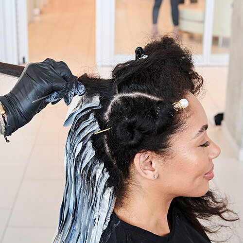 Hairstylist larisa love coloring clients hair