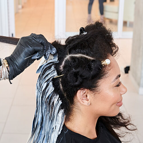 Hairstylist larisa love coloring clients hair