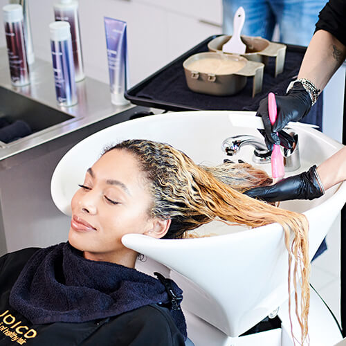 Hairstylist larisa love coloring clients hair