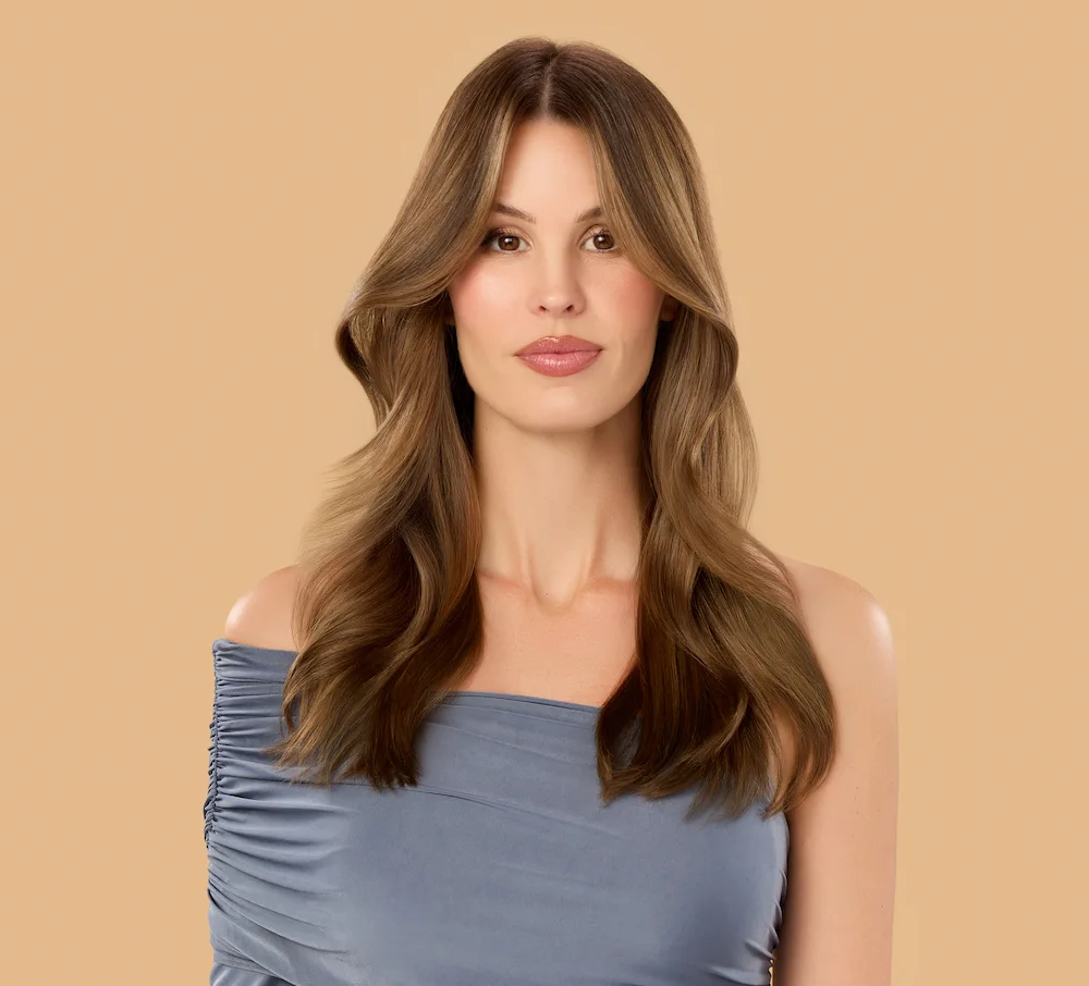 Model with mocha colored long hair posing